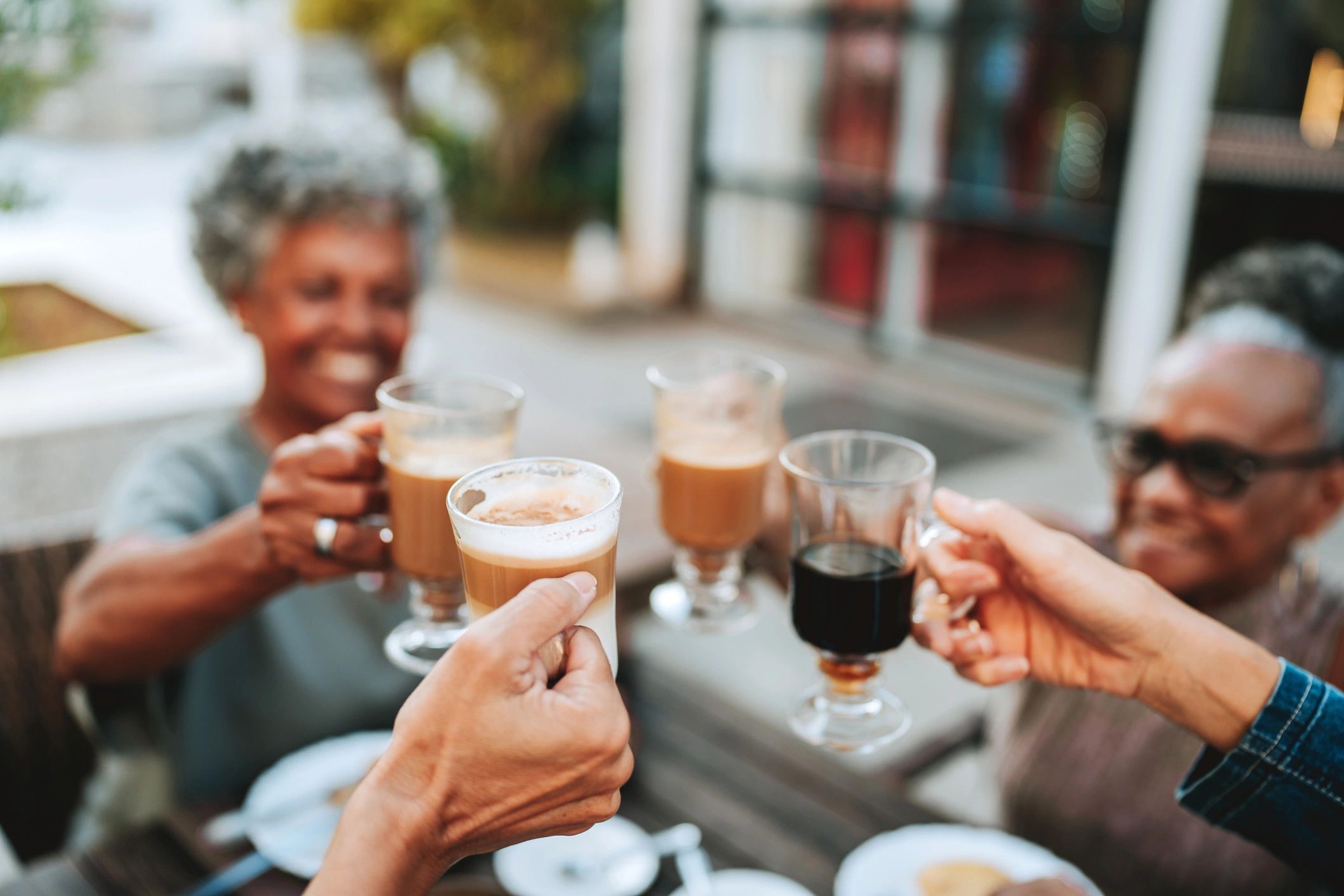 People gathered together with coffee, representing fellowship and community