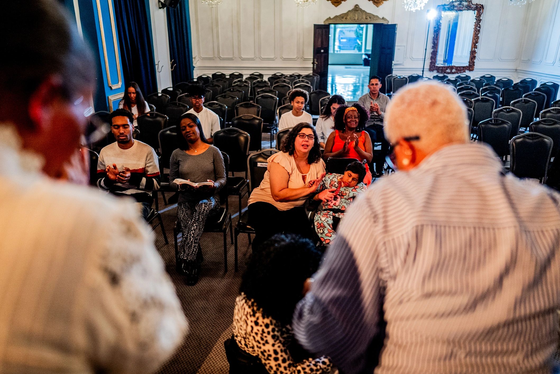 Diverse congregation seated during worship