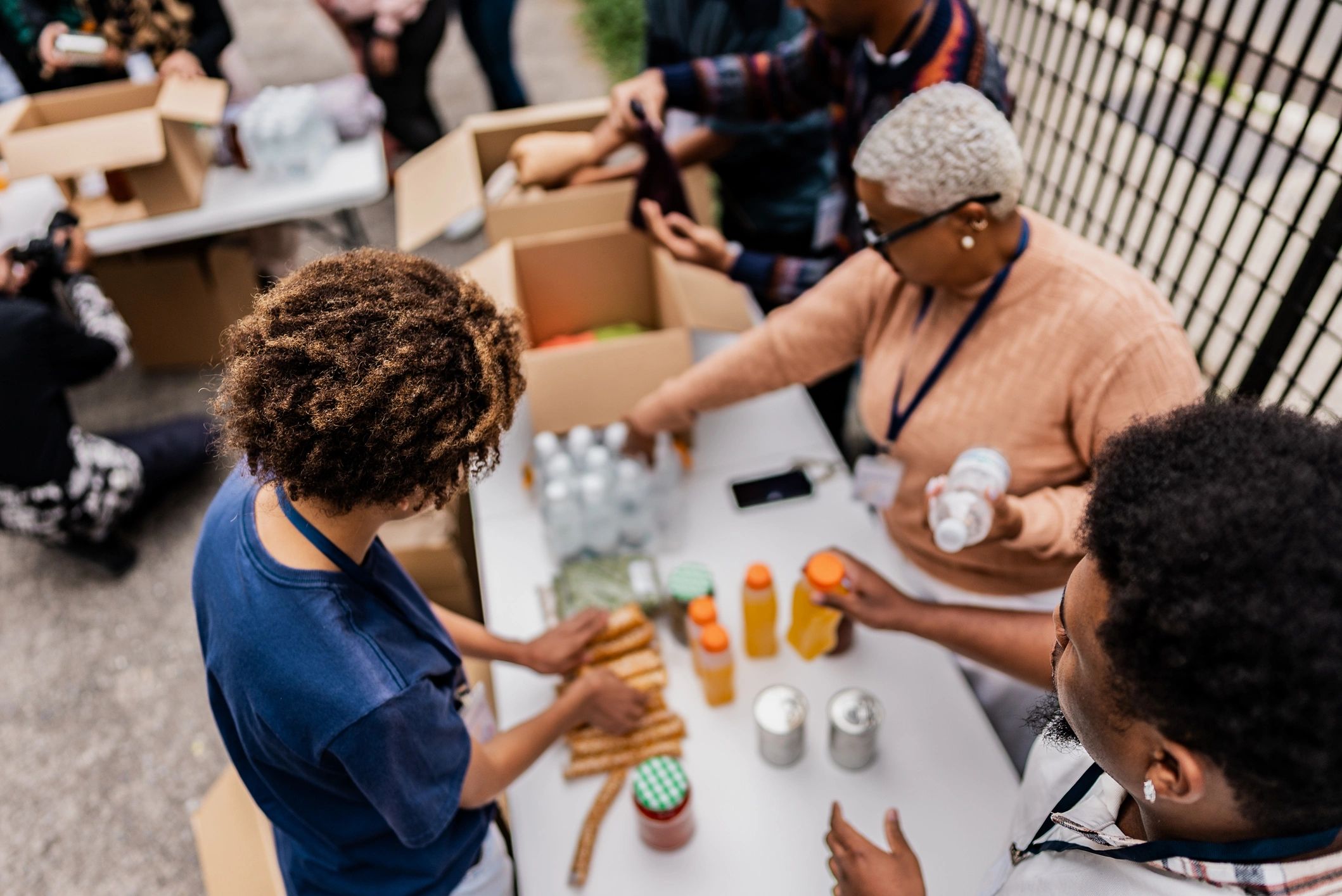 Teen volunteer sorting donated items during a service project