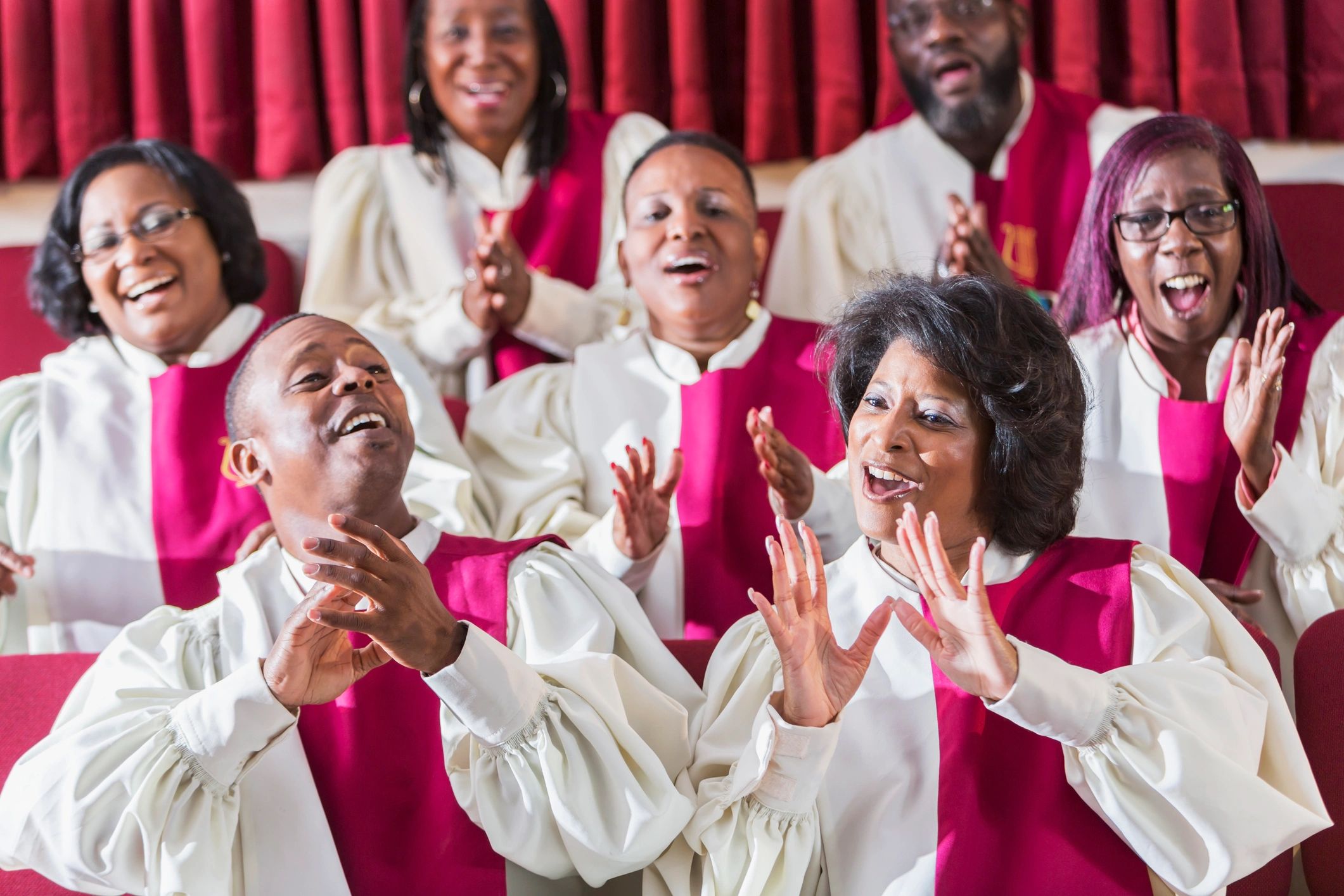 Church choir singing together in robes